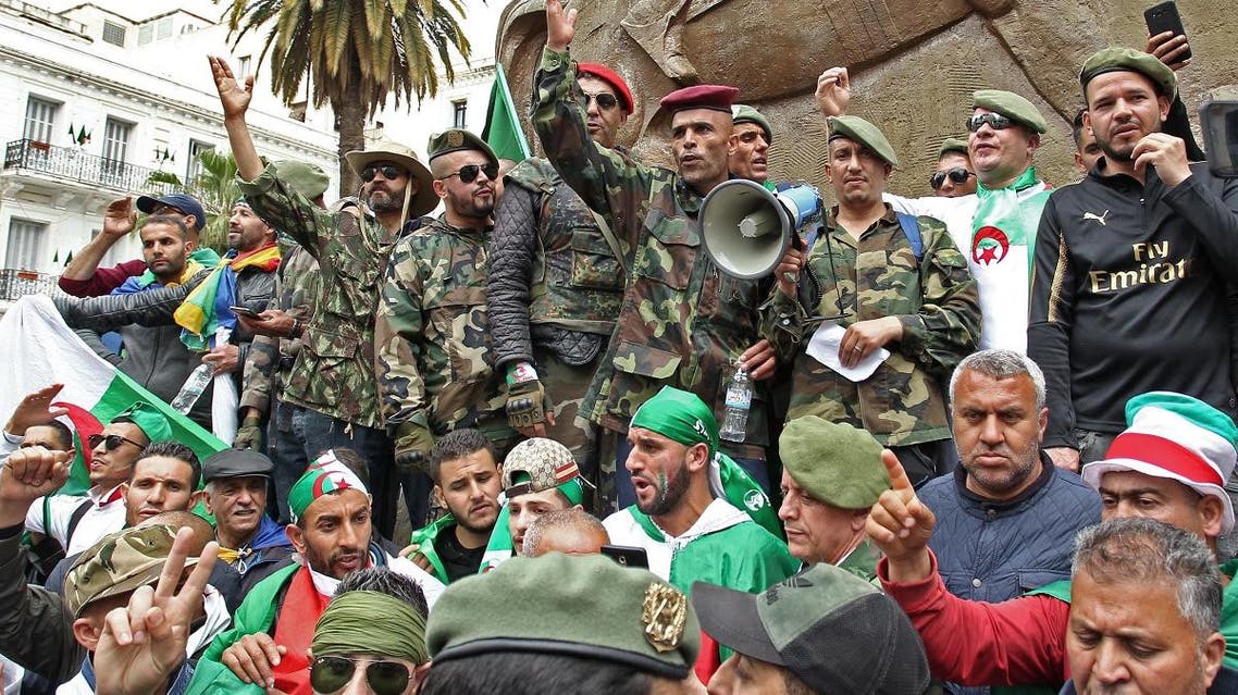 Algerian military veterans chant slogans as they take part in an anti-government demonstration at Emir Abdelkader square in the capital Algiers on April 19, 2019. (AFP)