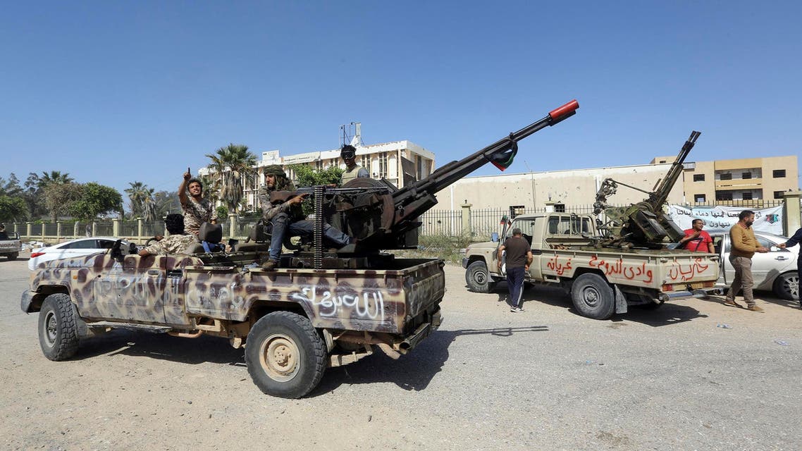 Forces loyal to Libya’s Government of National Accord gesture after taking control of the area of al-Aziziyah on April 18, 2019. (AFP)