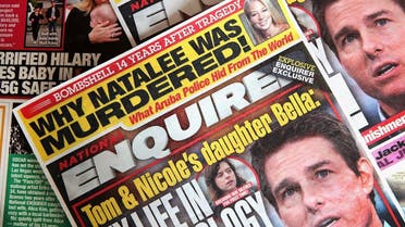 In this photo illustration, celebrity gossip dominates the cover of a National Enquirer magazine on April 11, 2019 in Chicago, Illinois. (AFP)