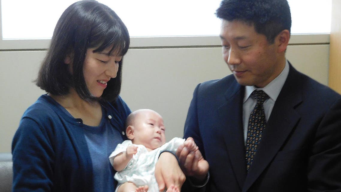 Six-month-old Ryusuke Sekiya (C) is pictured with his parents one day before his scheduled discharge from a hospital in Azumino, Nagano prefecture on April 19, 2019. (AFP)