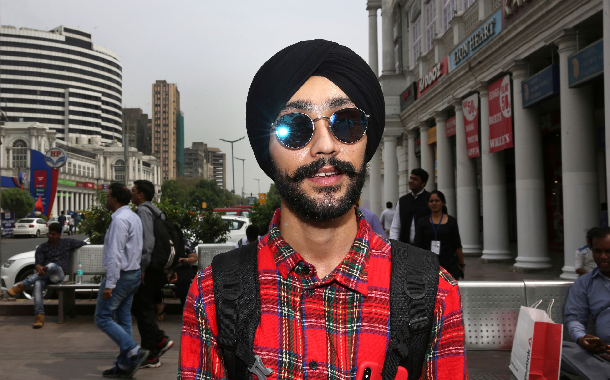 Rajanvir Singh Luthra, 23, a You Tube vlogger, stands for a photograph in New Delhi, India. (AP)