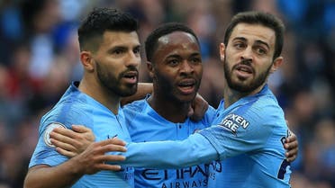Manchester City's English midfielder Raheem Sterling (C) celebrates with Manchester City's Argentinian striker Sergio Aguero (L) and Manchester City's Portuguese midfielder Bernardo Silva after scoring the team's first goal during the English Premier League football match between Manchester City and Brighton and Hove Albion at the Etihad Stadium in Manchester, north west England, on September 29, 2018. (AFP)
