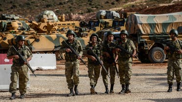 Turkish soldiers stand near armoured vehicles during a demonstration in support of the Turkish army's Idlib operation near the Turkey-Syria border near Reyhanli, Hatay, on October 10, 2017. (AFP)