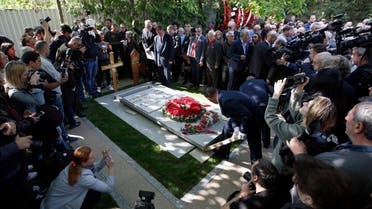 Workers place the stone onto the tomb of Mirjana Markovic, the widow of former strongman Slobodan Milosevic during her funeral at the yard of his estate in his home town of Pozarevac, Serbia. (AP)
