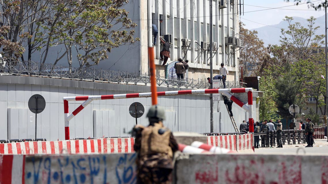 Afghan security personnel rescue men from the information and culture ministry after an attack near to the Telecommunication Ministry in Kabul, Afghanistan, Saturday, April 20, 2019. (AP)
