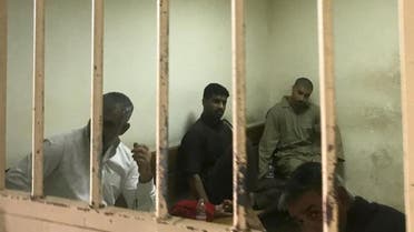 File photo of suspected ISIS members sits inside a cell at a court in Baghdad on May 10, 2018. (AFP) 