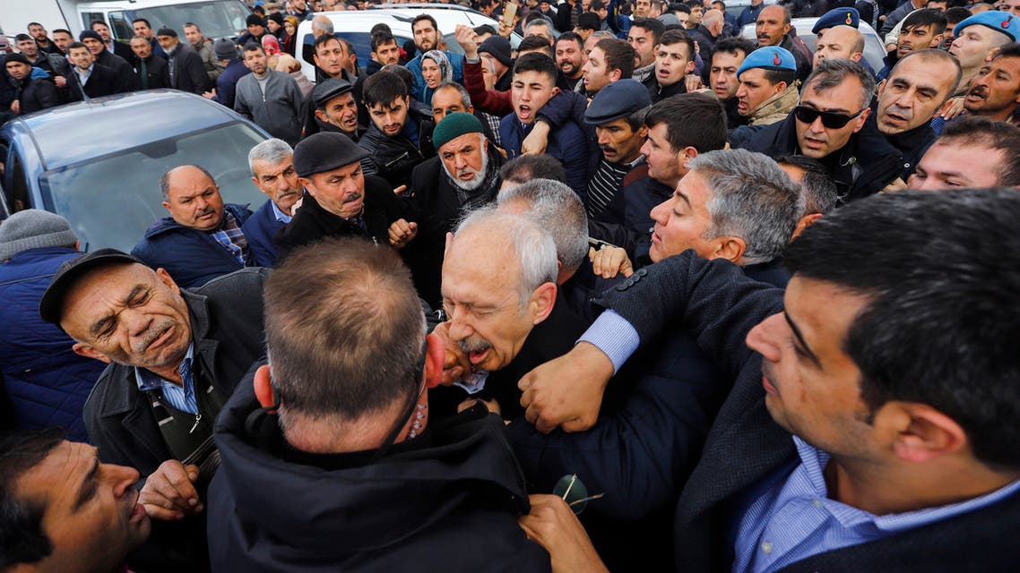 The Chairman of the Republican People's Party (CHP) Kemal Kilicdaroglu (C) is attacked by a protester on April 21, 2019 while attending a funeral ceremony in Ankara's Cubuk district for a soldier killed in fighting against Kurdish militants. The CHP last month won Ankara and Istanbul mayors' offices in local elections in a setback for President Recep Tayyip Erdogan's ruling party.
