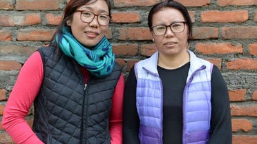 Furdiki Sherpa (R) and Nima Doma Sherpa (L), the Nepali widows of mountaineers, pose for a photo in Kathmandu. (AFP)