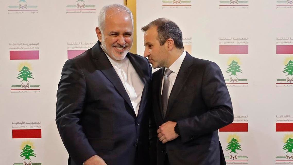 Lebanese Foreign Minister Gebran Bassil (R) speaks with his Iranian counterpart Mohammad Javad Zarif. (File photo: AFP)