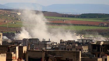 Smoke rises above building reported shelling in the town of Khan Sheikhun in the southern countryside of the rebel-held Idlib province. (AFP)