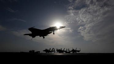 A U.S. Navy fighter jet lands on the deck of the U.S.S. Dwight D. Eisenhower aircraft carrier. (File photo: AP)