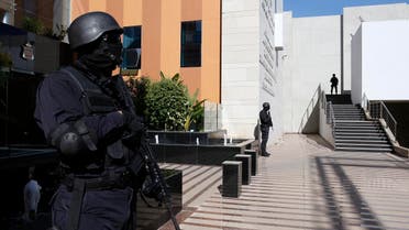Moroccan special anti-terror units guards walk inside the Central Bureau of Judicial Investigations headquarters in Sale, near Rabat. (AP)