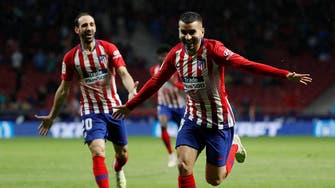 Atletico put Barca celebrations on ice with win over Valencia