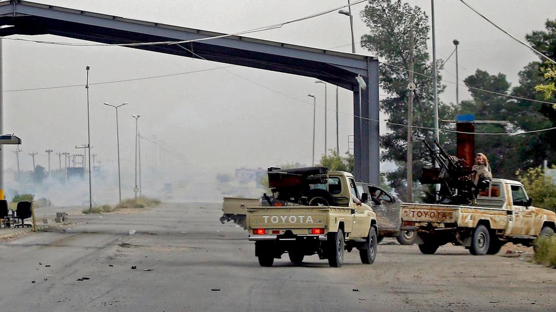 Vehicles belonging to Libyan fighters loyal to the Government of National Accord (GNA) are pictured during clashes with forces loyal to Khalifa Haftar south of the capital Tripoli, on April 23, 2019. (AFP)