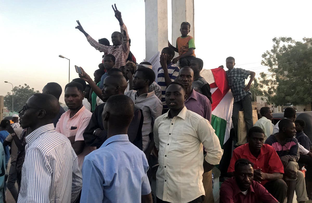 Sudanese demonstrators chant slogans as they attend a mass anti-government protest at the Nyala market in South Darfur, Sudan, on April 24, 2019. (Reuters)