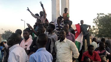 Sudanese demonstrators chant slogans as they attend a mass anti-government protest at the Nyala market in South Darfur, Sudan, on April 24, 2019. (Reuters)