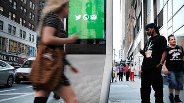 A man uses one of the new Wi-Fi kiosks that offer free web surfing, phone calls and a charging station in New York City. (AFP)