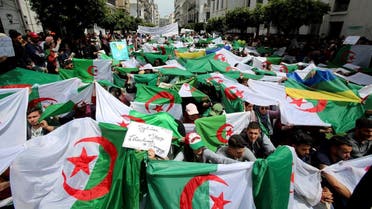 Demonstrators hold flags and banners during anti government protests in Algiers, Algeria April 23, 2019. (Reuters)