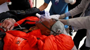 Malaysian climber Wui Kin Chin is being transferred from a helicopter to the hospital for treatment after being rescued from Mount Annapurna in Kathmandu (AP)