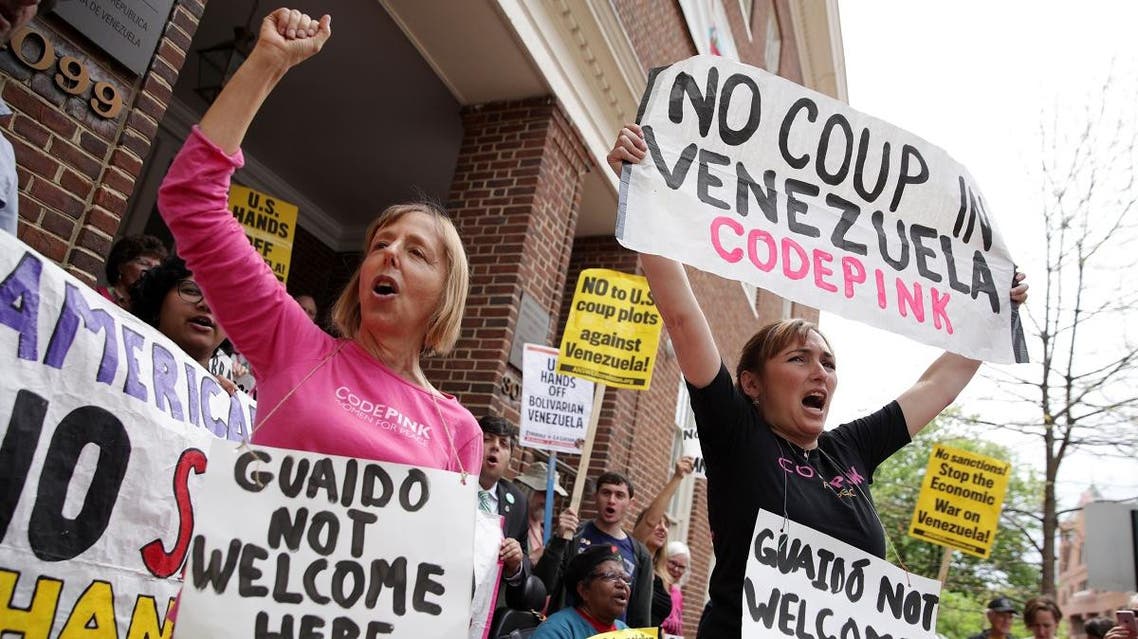Medea Benjamin (L) and Ariel Gold (R) of CodePink shout slogans during a news conference outside the Embassy of Venezuela April 25, 2019 in Washington, DC. (AFP)