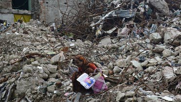 A mourner grieves at the scene of Rana Plaza garment building the site of Bangladesh’s worst industrial disaster. (AFP)