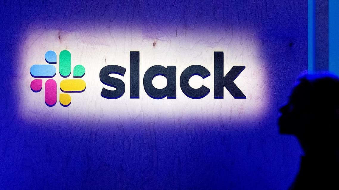 an attendee walks by the company’s logo during Slack’s Frontiers conference at Pier 27 & 29 in San Francisco. (AFP)