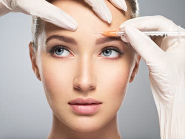 A stock image of a woman getting cosmetic botox injection in her forehead. (File photo)