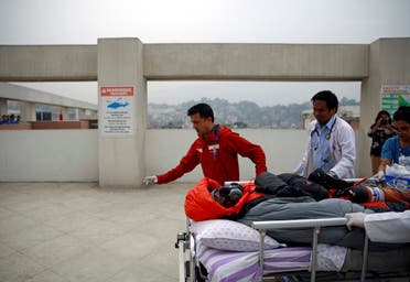 Malaysian climber Wui Kin Chin is being transferred from a helicopter to the hospital for treatment after being rescued from Mount Annapurna in Kathmandu (AP)