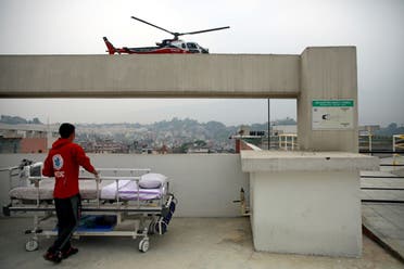 Malaysian climber Wui Kin Chin is being transferred from a helicopter to the hospital for treatment after being rescued from Mount Annapurna in Kathmandu (AP)