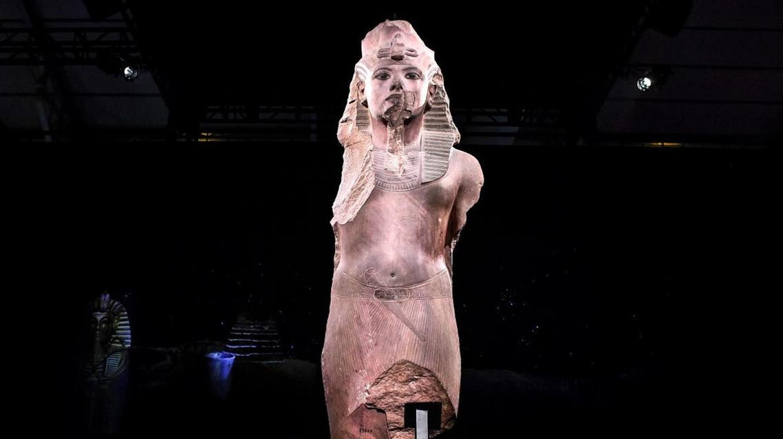 A sculpture of ‘Tutankhamun usurped by Horemheb’, is displayed during the exhibition ‘Tutankhamun,Treasures of the Golden Pharaoh’ on March 21, 2019 at La Villette in Paris. (AFP)
