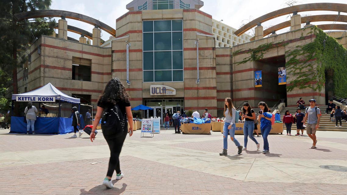 People pass Ackerman Student Union on the campus of the University of California, Los Angeles Friday, April 26, 2019. (AP)