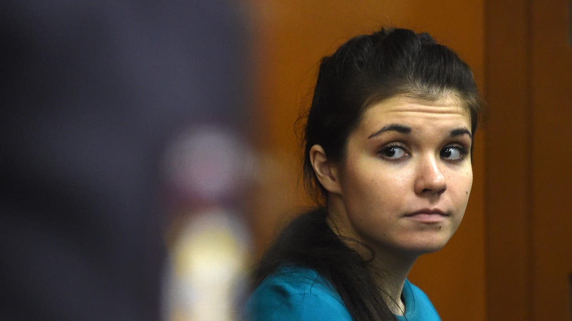 In this file photo taken on December 22, 2016 Moscow State University student Varvara Karaulova sits inside a defendants' cage during a hearing at Moscow's District Military Court. (AFP)