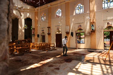 n this Thursday, April 25, 2019 photo, a surveyor walks inside the damaged St. Sebastian's Church where a suicide bomber blew himself up on Sunday Easter in Negombo, north of Colombo, Sri Lanka. (AP)