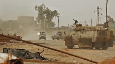 This video grab - showing armed vehicles firing reportedly during clashes with forces loyal to Libya’s UN-recognized Government on the outskirts of the capital Tripoli - was published on Haftar’s Libyan National Army (LNA) War Information Division’s Facebook page on April 24, 2019. (AFP)