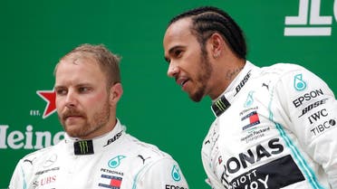 Mercedes' Lewis Hamilton with Mercedes' Valtteri Bottas on the podium after the race. (Reuters)