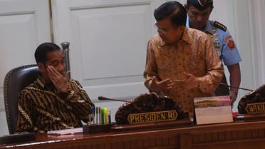 Indonesian President Joko Widodo talks with Indonesian Vice President Jusuf Kalla before a meeting about the plan to relocate the capital city. (Reuters)