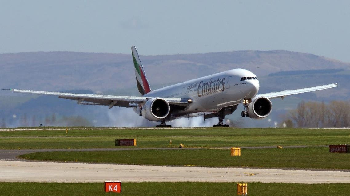 An Emirates Boeing 737-300 passenger jet lands at Manchester Airport in Manchester. (AFP)