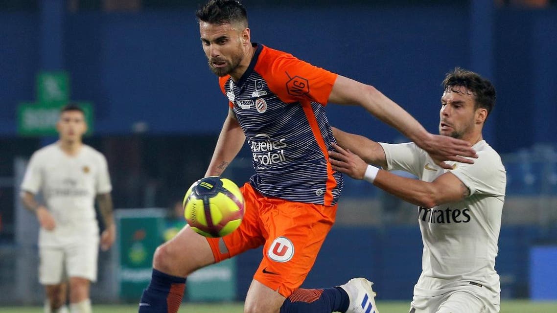Montpellier’s Damien Le Tallec in action with Paris St Germain’s Juan Bernat. (Reuters)