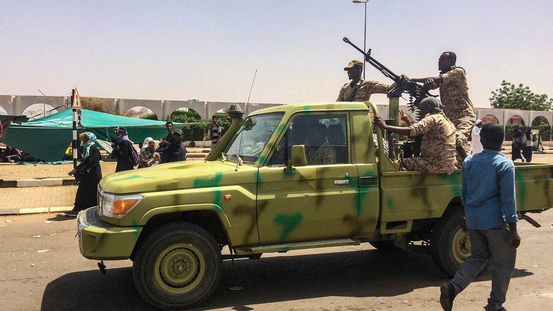 Sudanese army soldiers patrol near protesters gathered near the military headquarters, Tuesday, April 9, 2019. (AP)