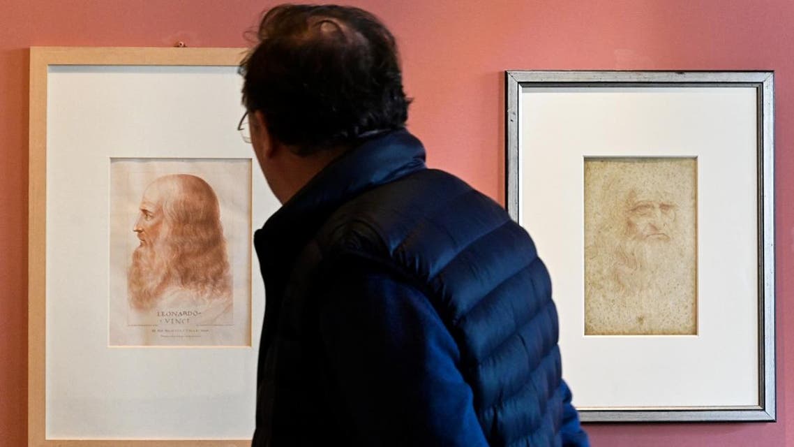 A portrait of Leonardo Da Vinci by Francesco Melzi (L) and a Da Vinci self-portrait (R) at the Leonardo Da Vinci museum during an exhibition marking the 500th anniversary of the death of Renaissance artist, on May 2, 2019 in Vinci, Tuscany. (AFP)