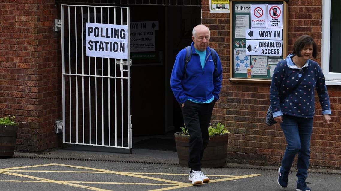 Voters leave a polling station at a community centre in Featherstone, Wolverhampton, north west England as local council elections get underway on May 2, 2019. (AFP)