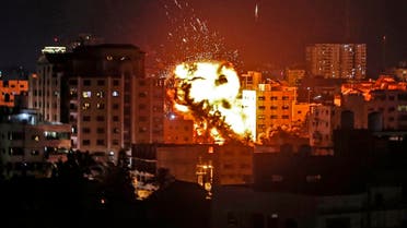 An explosion is pictured among buildings during an Israeli airstrike on Gaza City. (AFP)