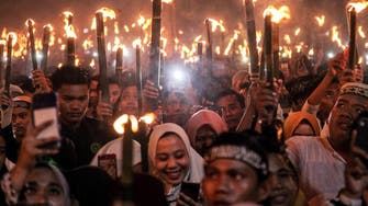 Shared meals and torch-lit parades: Indonesia Muslims welcome Ramadan