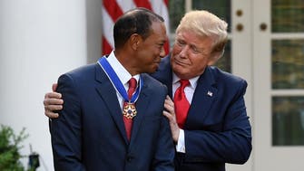 Emotional Tiger Woods accepts Medal of Freedom at White House