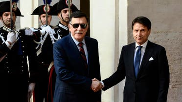 Giuseppe Conte (R) greets Fayez al-Sarraj in Rome on May 7, 2019. (AFP)