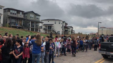 People wait outside near the STEM School during a shooting incident in Highlands Ranch, Colorado, U.S. in this May 7, 2019 image obtained via social media. (Reuters)