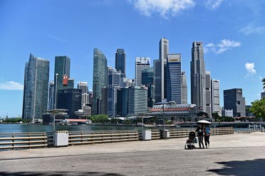 People walking near the central business district in Singapore on May 6, 2019. (AFP)
