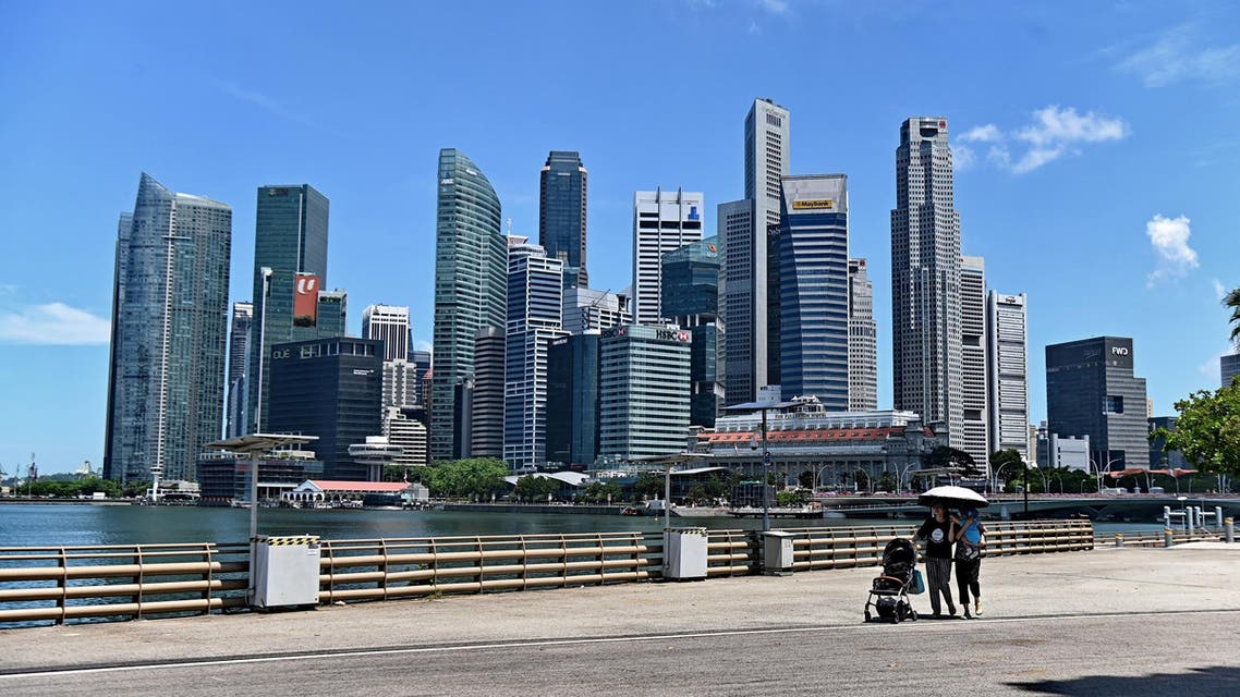 People walking near the central business district in Singapore on May 6, 2019. (AFP)