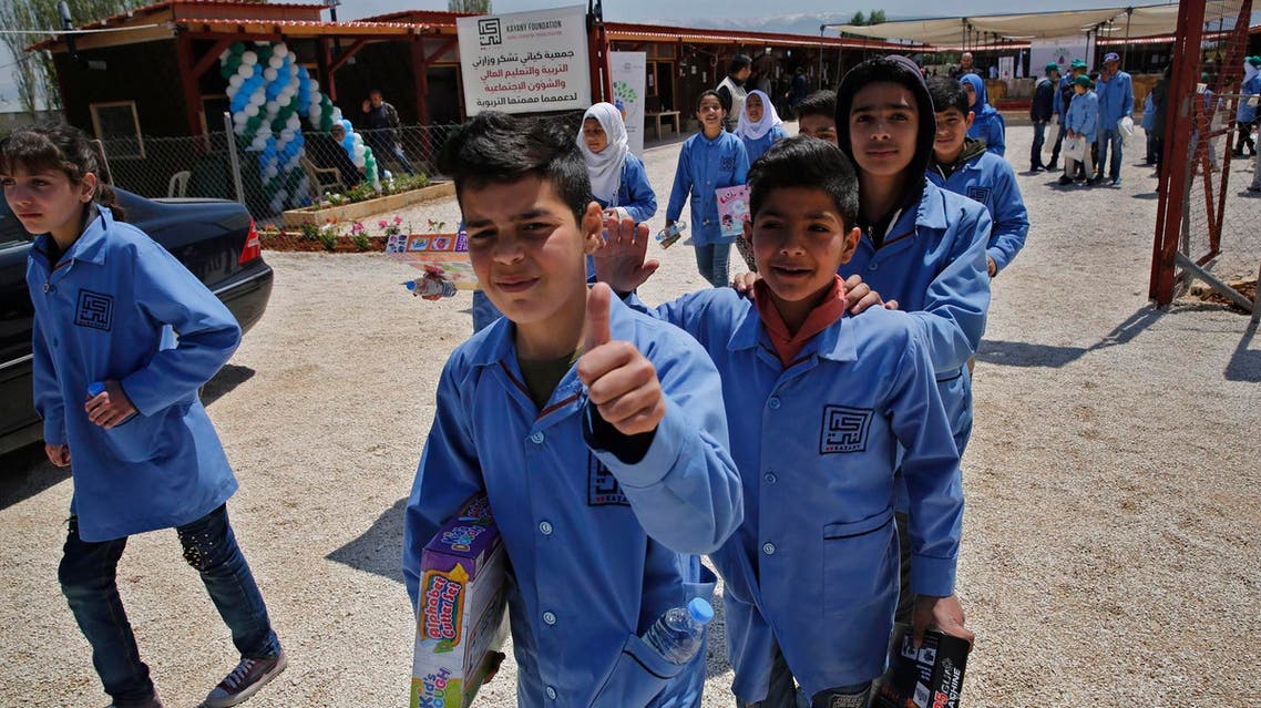 Refugee students leave their makeshift school in the Bekaa valley town of Saadnayel, east Lebanon, on April 23, 2019. (AP)
