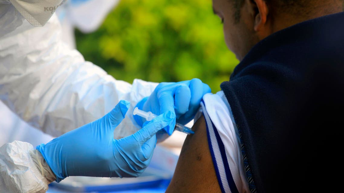In this Aug. 8, 2018, file photo, a healthcare worker from the World Health Organization gives an Ebola vaccination to a front line aid worker in Mangina, Democratic Republic of Congo. (AP)